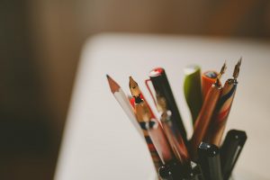 A pot of pens used by Creative Calligraphy founder Angela Reed