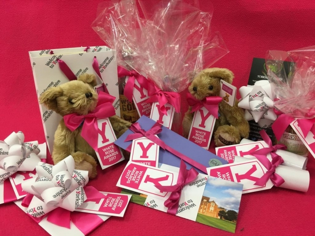 Assorted gifts, vouchers and chutneys wrapped in Welcome to Yorkshire giftwrap