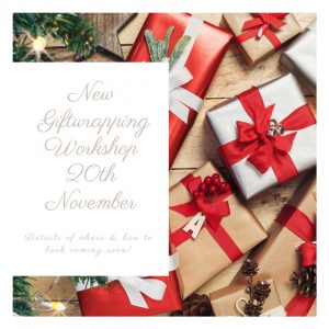 Pretty silver & red packages and information about the new giftwrapping workshop