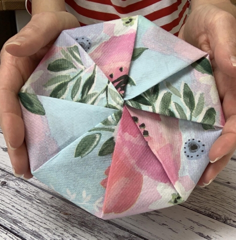 8 sided box of chocolates wrapped in a floral giftwrap