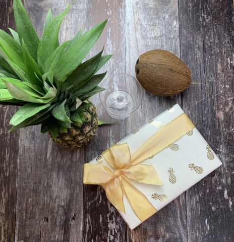 Pineapple giftwrapped box with a fresh pineapple, coconut & cocktail glass