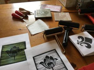 A selection of lino print images and the tools to create them